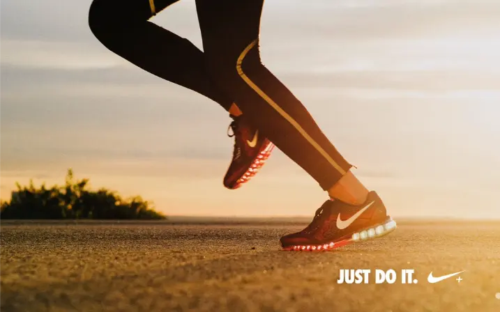 Nike just do it banner showcasing runner aesthetics demonstrating desire-building AIDCA copywriting.