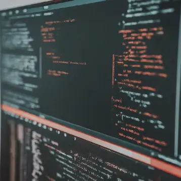 lines of red and turquoise code on a screen