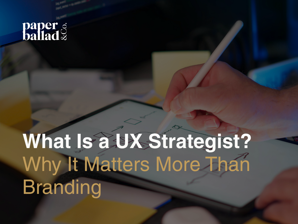 A hand uses a stylus on a tablet to sketch user experience flows, with overlay text reading “What Is a UX Strategist? Why It Matters More Than Branding,” representing UX strategy planning and design thinking.