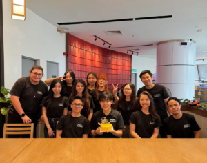 A group of young people in Paperballad&Co. posing for a group photo